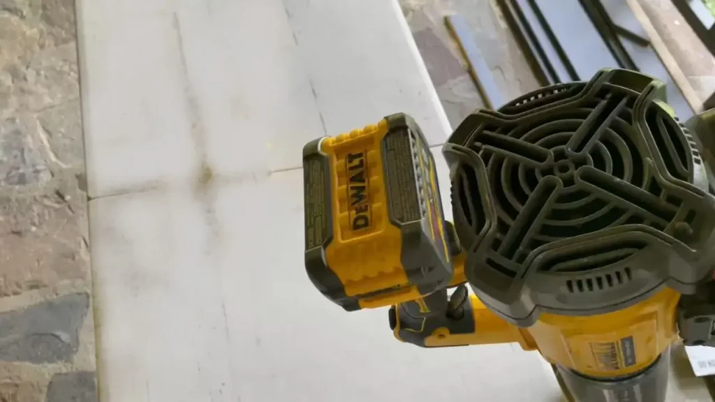 A close-up view of the rear fan and battery attachment on a DEWALT DCBL722B blower.
