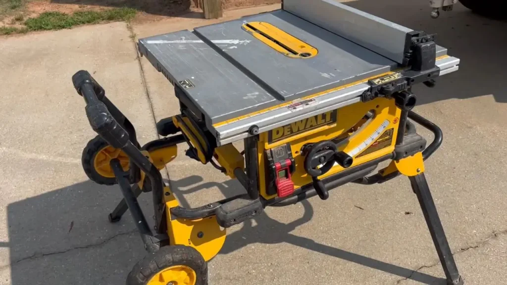 DeWalt DWE7491RS 10-inch table saw with its stand on concrete outdoors (Smart AI Gears)