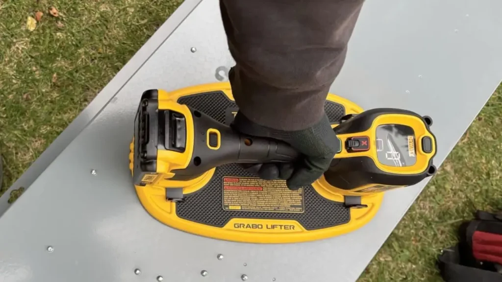 DeWalt Grabo Lifter Review Smart AI Gears lifting metal sheet