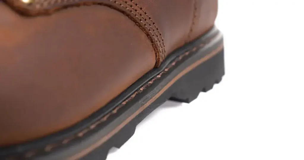 Side view of EVER BOOTS Tank 2025 model boot showing full-grain leather construction, padded collar, and rugged tread sole