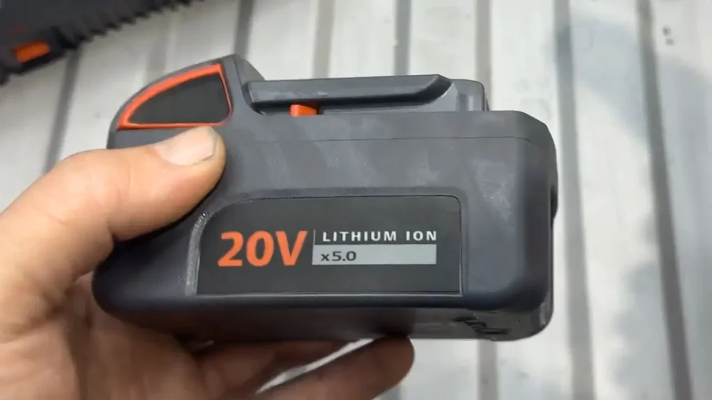 A hand holding the powerful 20V 5.0Ah lithium-ion battery for the Ingersoll Rand D5241 hammer drill.
