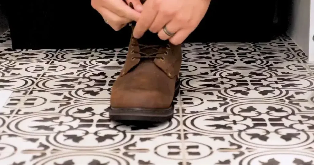 Man wearing the EVER BOOTS Tank 2025 work boot on one foot for fit and comfort testing