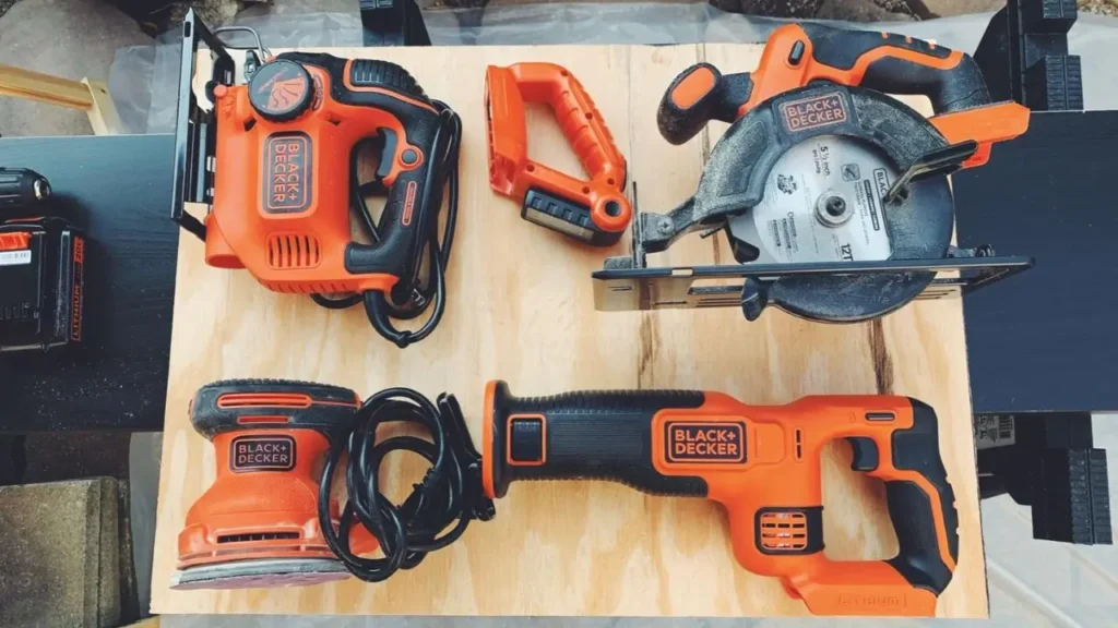 Black+Decker Combo Kit laid out, showing circular saw, reciprocating saw, drill, and light on wood – Smart AI Gears