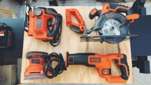 Black+Decker Combo Kit laid out, showing circular saw, reciprocating saw, drill, and light on wood – Smart AI Gears