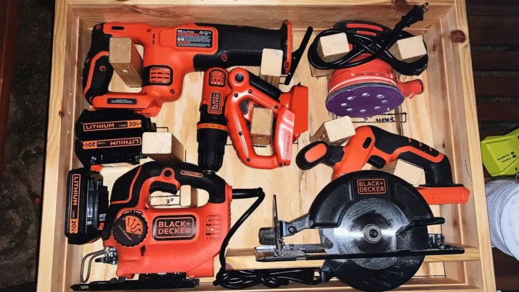 Black+Decker 20V MAX tools neatly arranged in a wooden box.