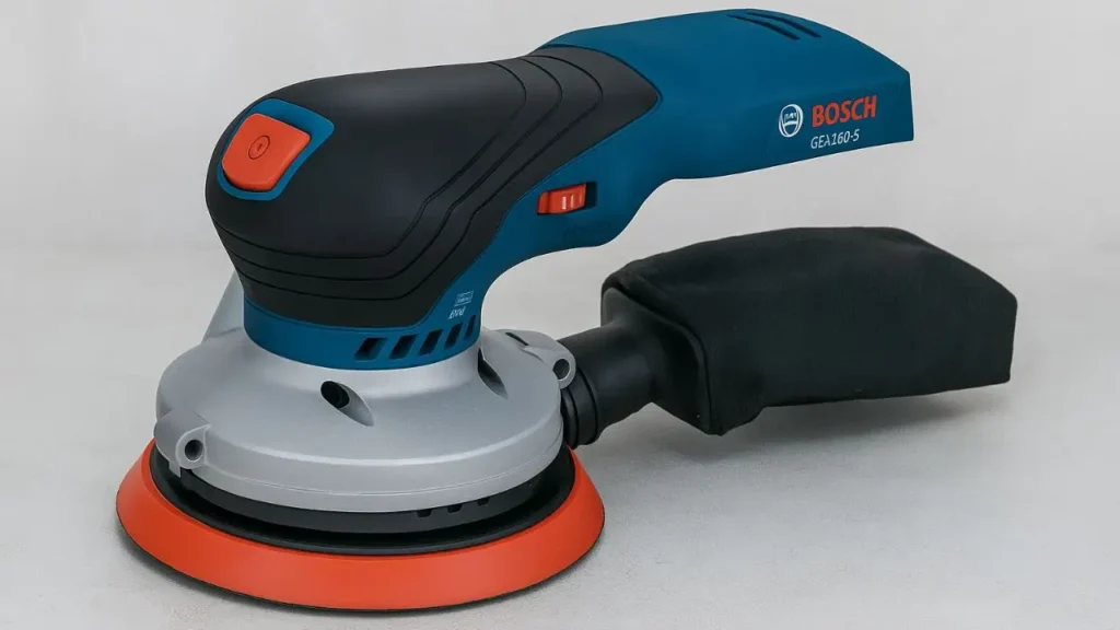 A side view of the blue and grey Bosch GEX18V-5N random orbital sander with its dust bag attached.