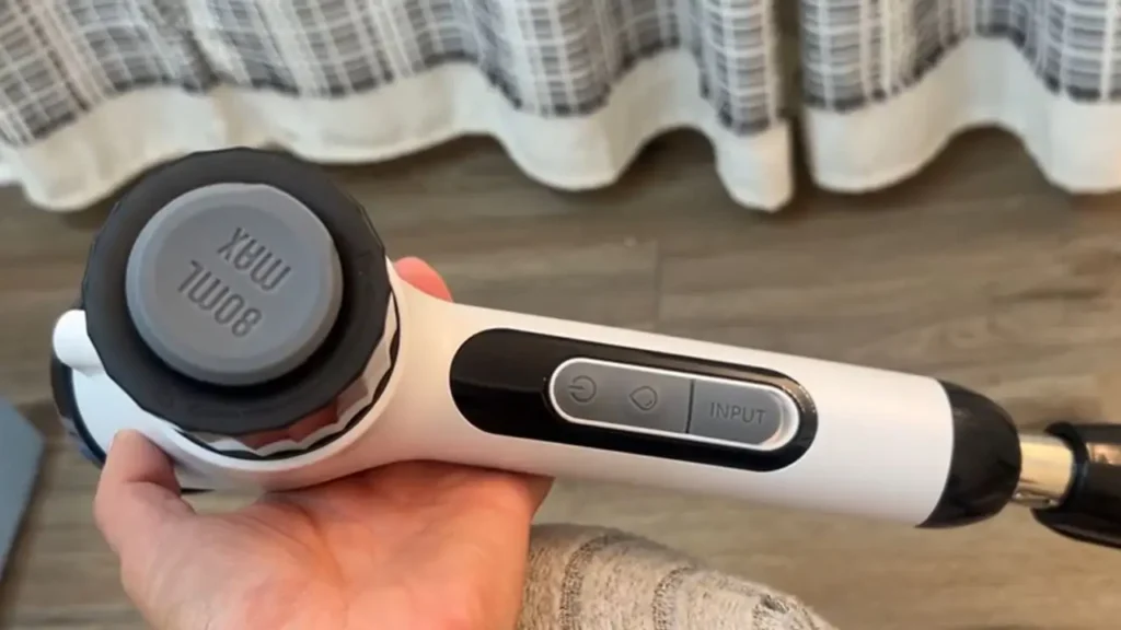 The control panel and charging port of the electric spin scrubber.