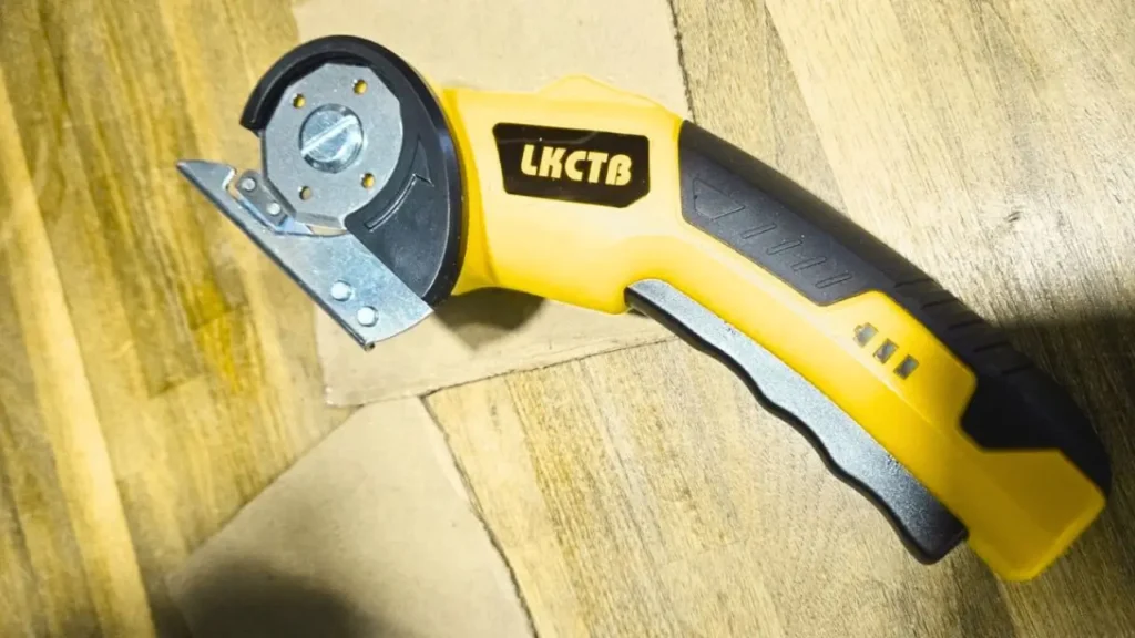 Electric scissors cutting through cardboard with precision