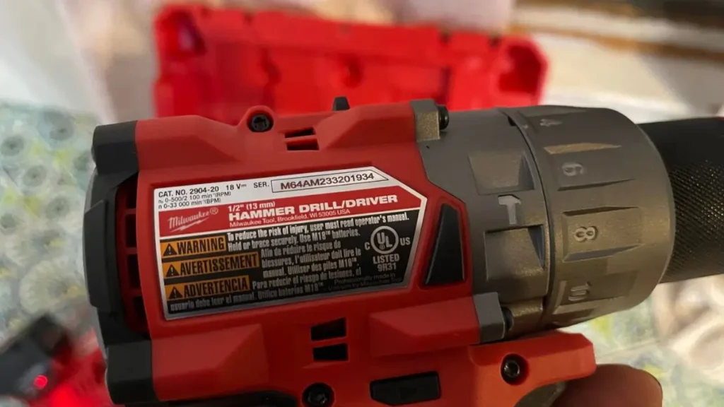 A close-up of the specification sticker on the Milwaukee M18 FUEL hammer drill, showing the model number CAT. NO. 2904-20.