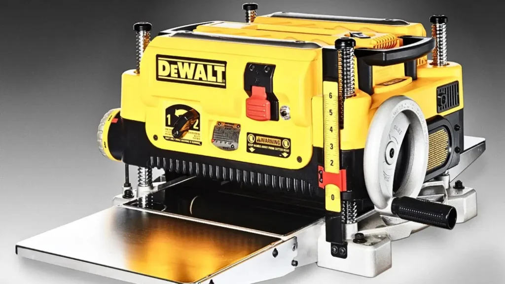 A detailed, high-resolution product shot of the DEWALT DW735X thickness planer with its yellow body and metal base. Reviewed at Smart AI Gears.