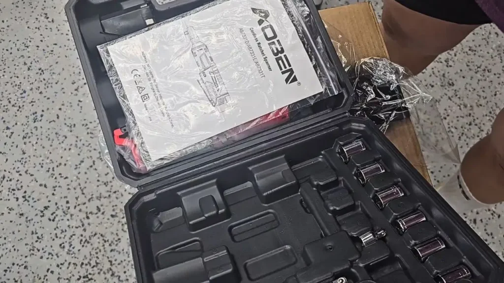 The AOBEN 12V Ratchet Set with user manual and socket set inside the box