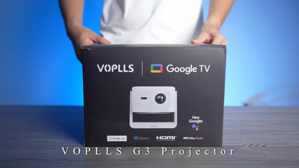 A photo of the VOPLLS G3 projector box, showing the Google TV and Dolby Audio logos.