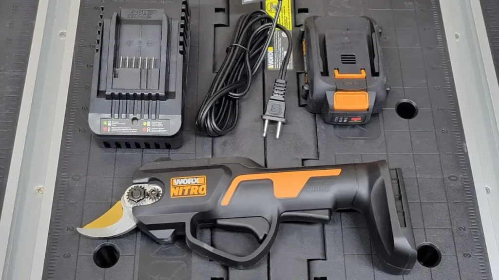 Worx Pruner WG330 review kit, showing the 20V Nitro pruner, two PowerShare batteries, and charger for Smart AI Gears.