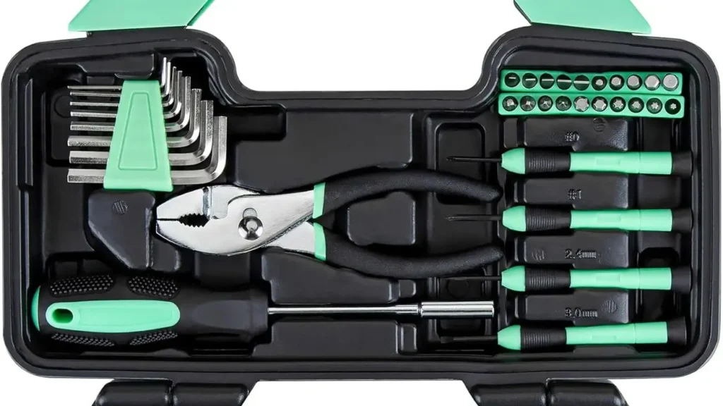 Overhead view of the open CARTMAN tool kit, showing the slip-joint pliers, hex keys, and precision screwdrivers.