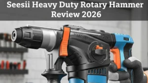 A person's hand holding a blue and black Seesaw Heavy Duty Rotary Hammer Drill in a workshop setting, featured on Smart AI Gears.