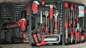 An open case displaying the complete KingTool 276 Piece Set, including a 12V cordless drill, hand tools, sockets, and accessories. Review at Smart AI Gears