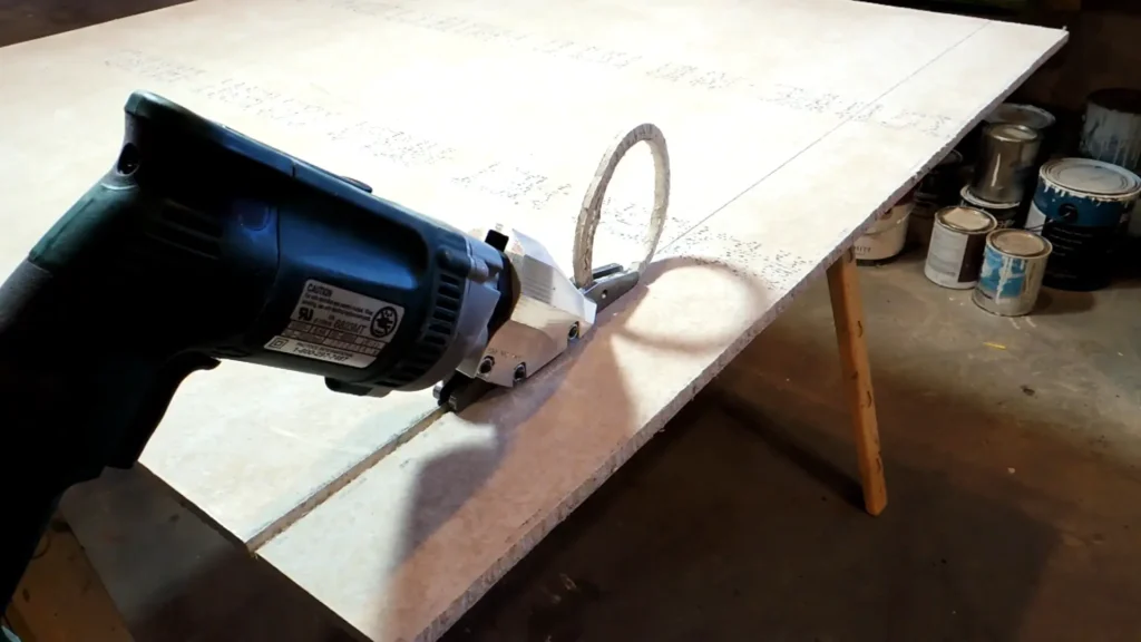 A user guiding the PacTool SS724 attachment with precision to pare down a workpiece.