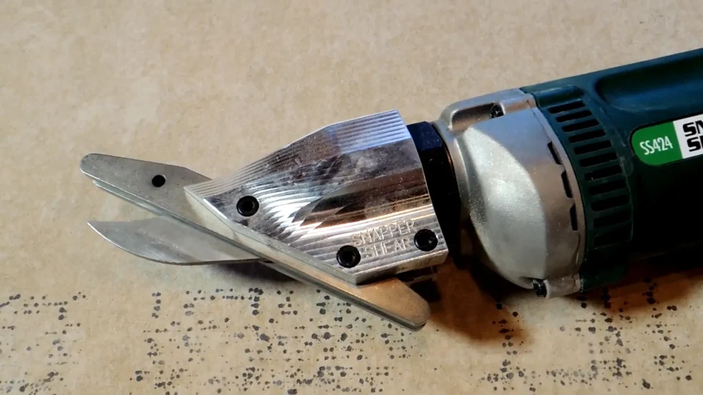 Profile view of the cutting head of the PacTool SS724, showing the specialized blade geometry.