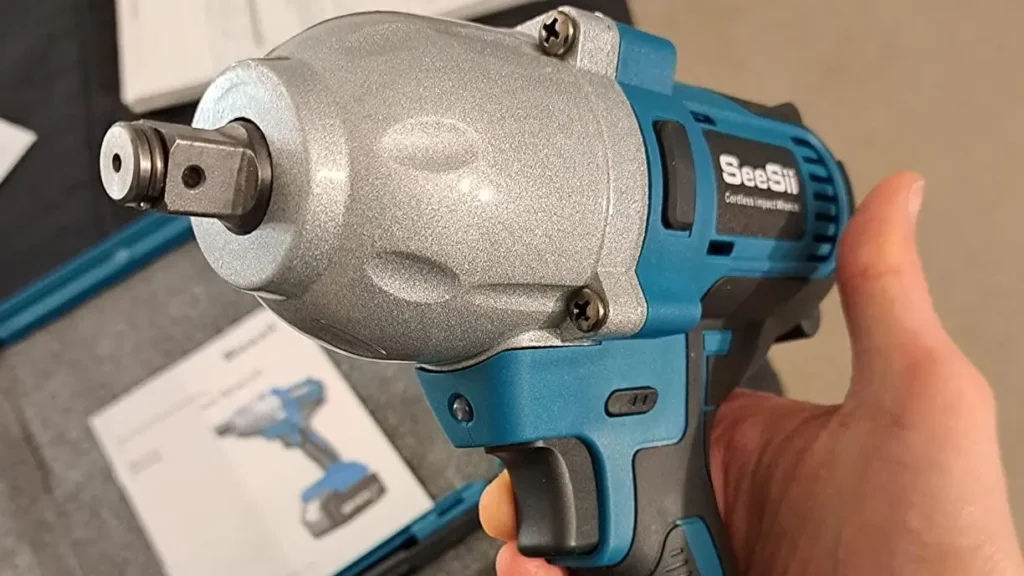 Extreme close up of the half inch square drive anvil showing the tight metal retaining pin and black rubber O-ring.