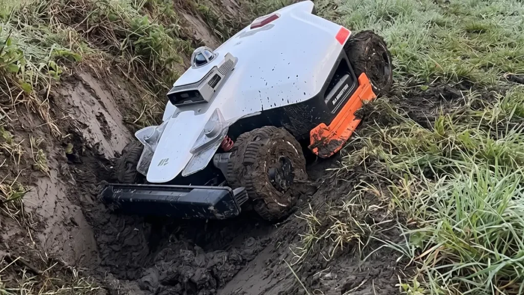 Mammotion LUBA 3 AWD robot mower nosedived and stuck in thick mud after missing a digital boundary map.