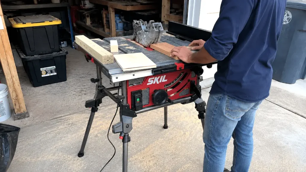 Hands placing different types of wood including 2x4s and plywood on the table saw surface for testing.